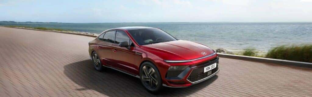 2024 Hyundai Sonata in red by the Gulf of Mexico