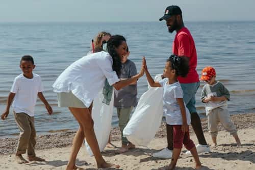Cleaning the beach and A Woman and Girl Doing High Five