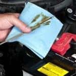 Mechanic checking oil level