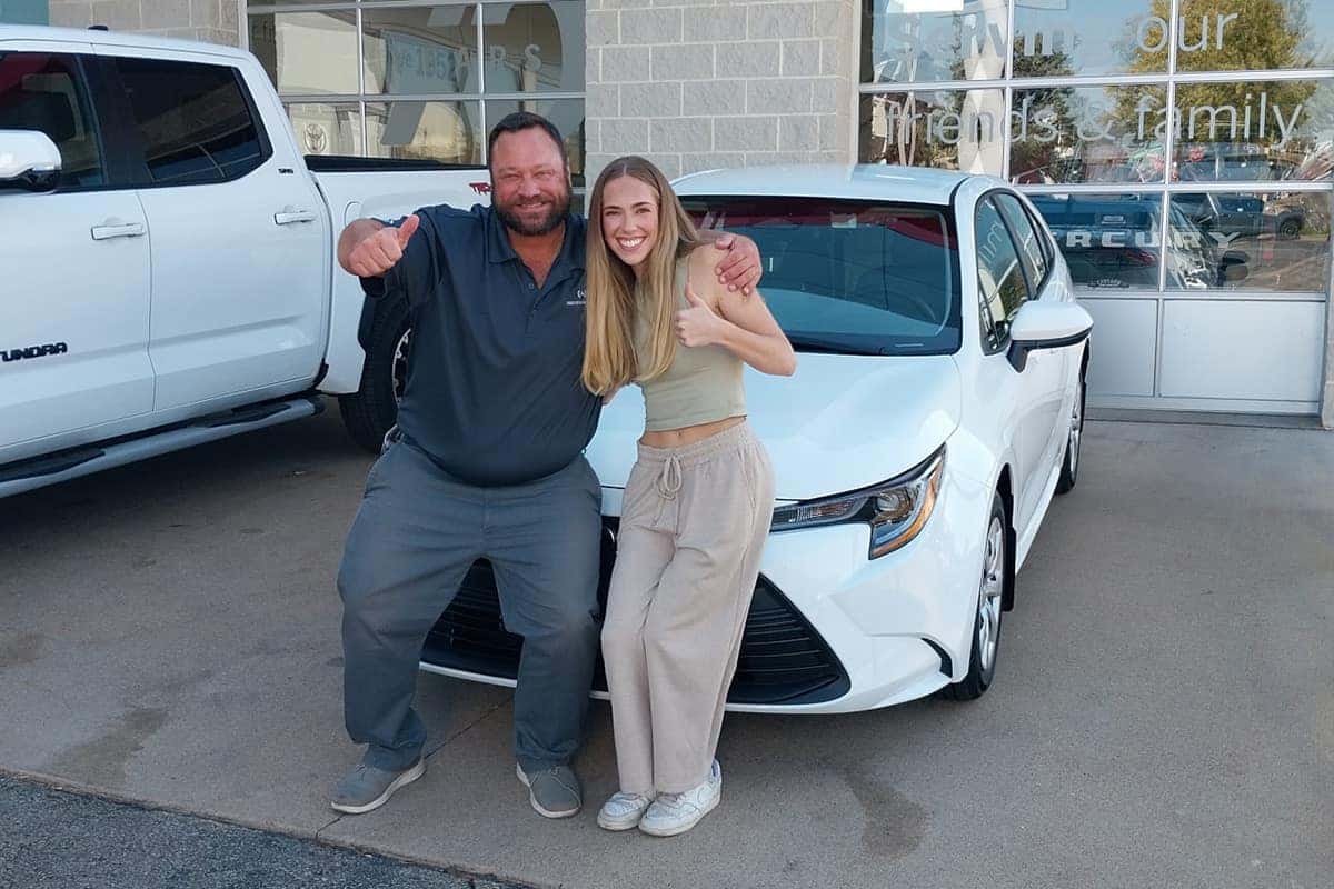 sales consultant kris wolfe delivering a toyota corolla