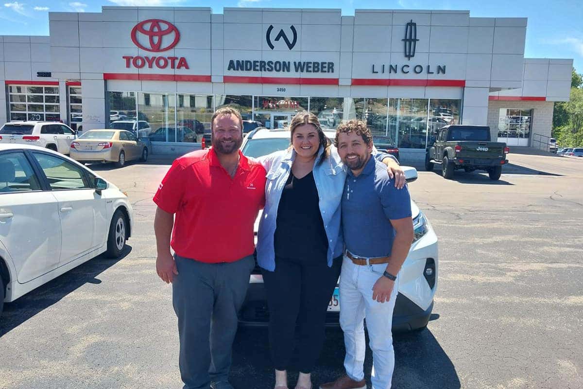 sales manager shane burtzlaff and sales consultant kris wolf delivering a new toyota