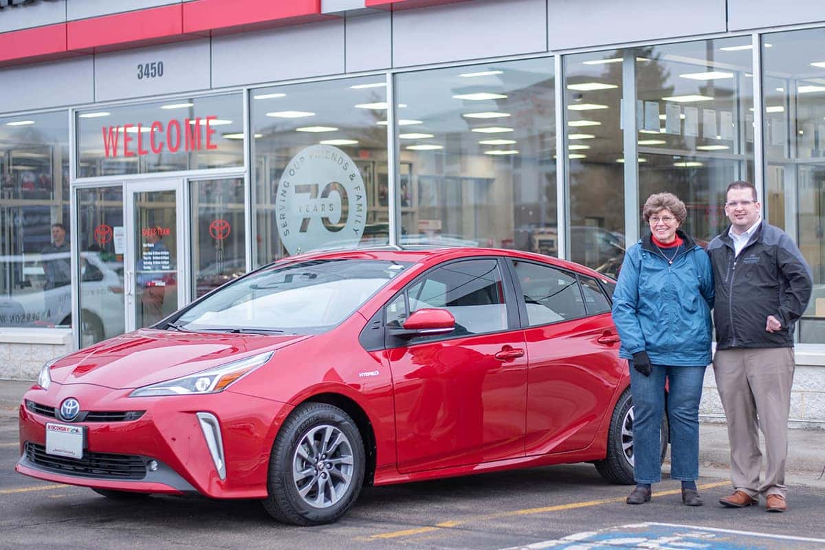 sales consultant Nick Heston delivering a Toyota prius