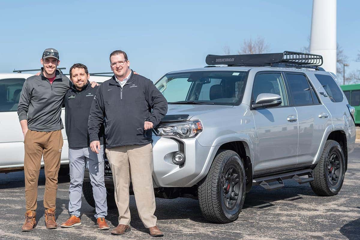 sales manager shane burtzlaff and sales consultant nick heston delivering a new toyota 4runner