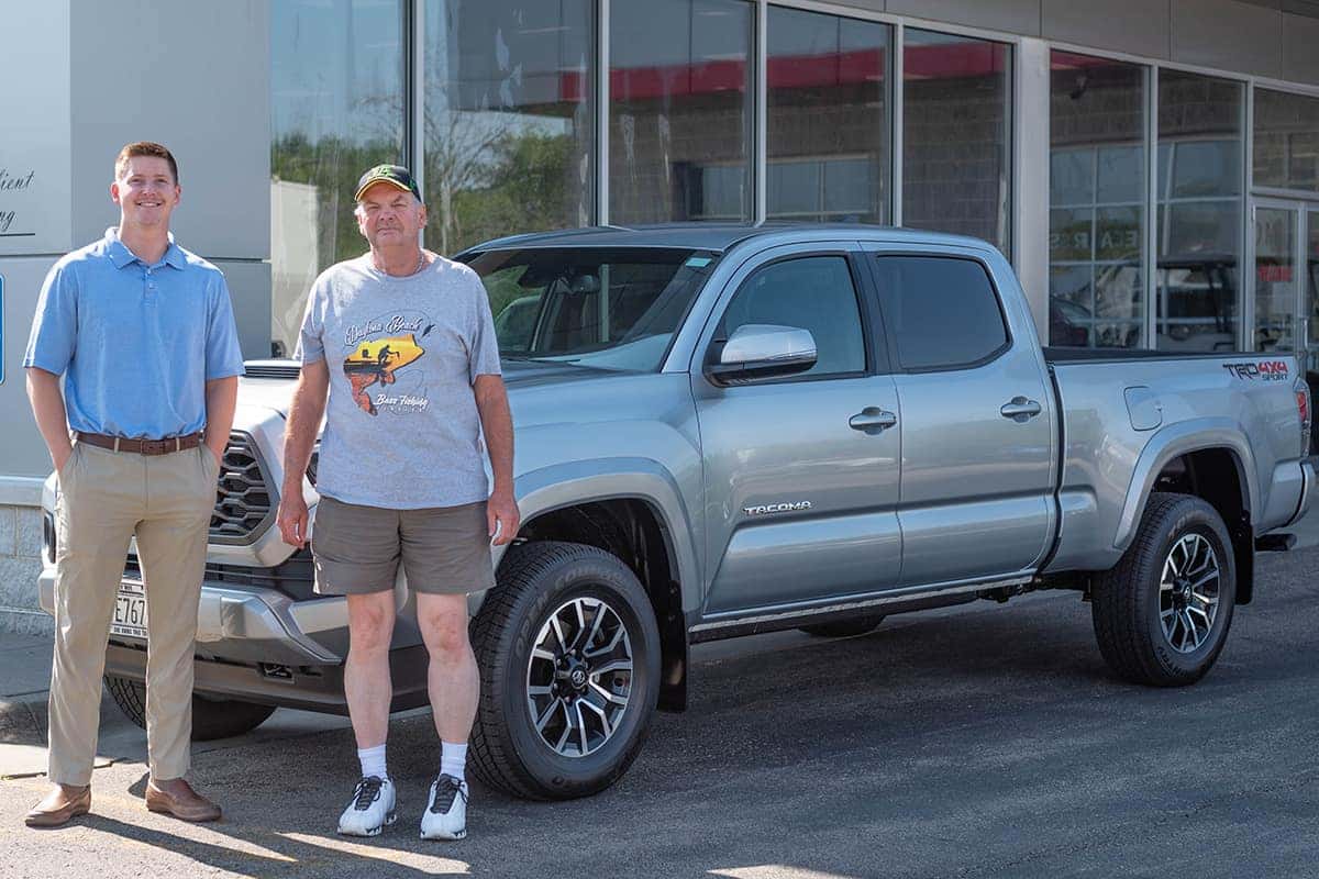 sales consultant payton duit delivering a toyota tacoma