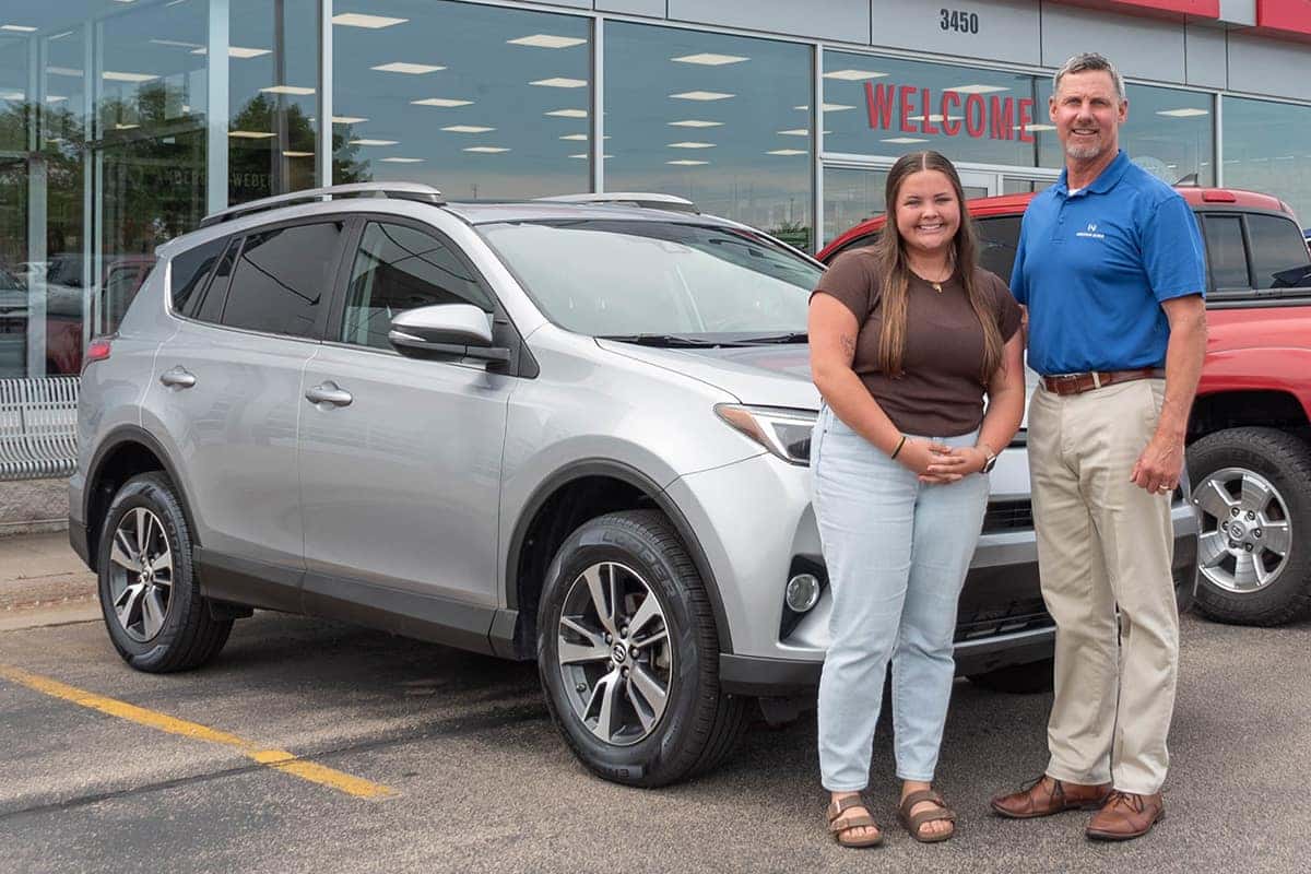 Sales Consultant Chris Ludescher delivering a toyota rav4