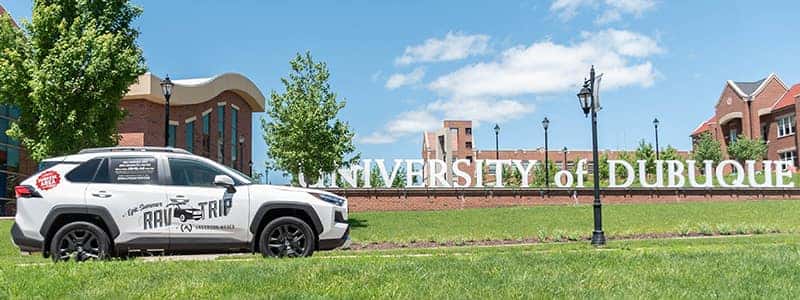 a photo of a rav4 at the university of dubuque promoting for anderson weber's epic summer rav trip
