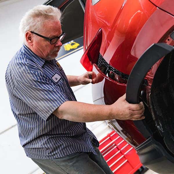 an auto body technician working at abra auto body at anderson weber toyota in dubuque iowa