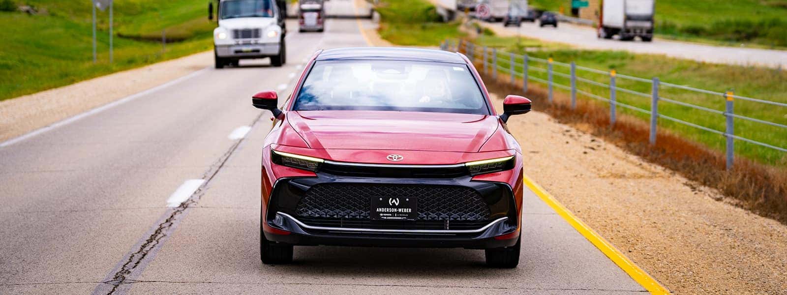 a new toyota crown from anderson weber toyota driving into dubuque iowa