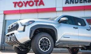 a new toyota tacoma in front of anderson weber toyota in dubuque iowa
