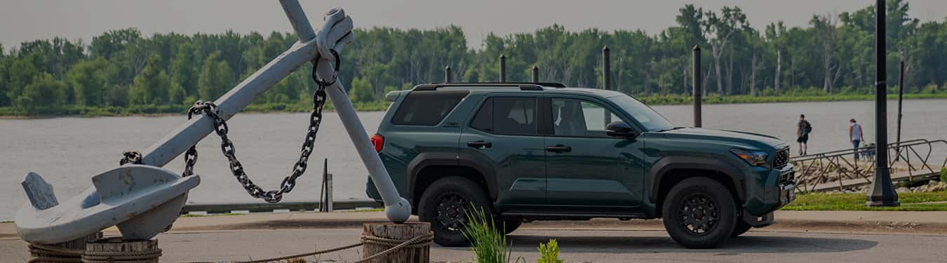a brand new 4runner from anderson-weber toyota parked next to the mississippi river