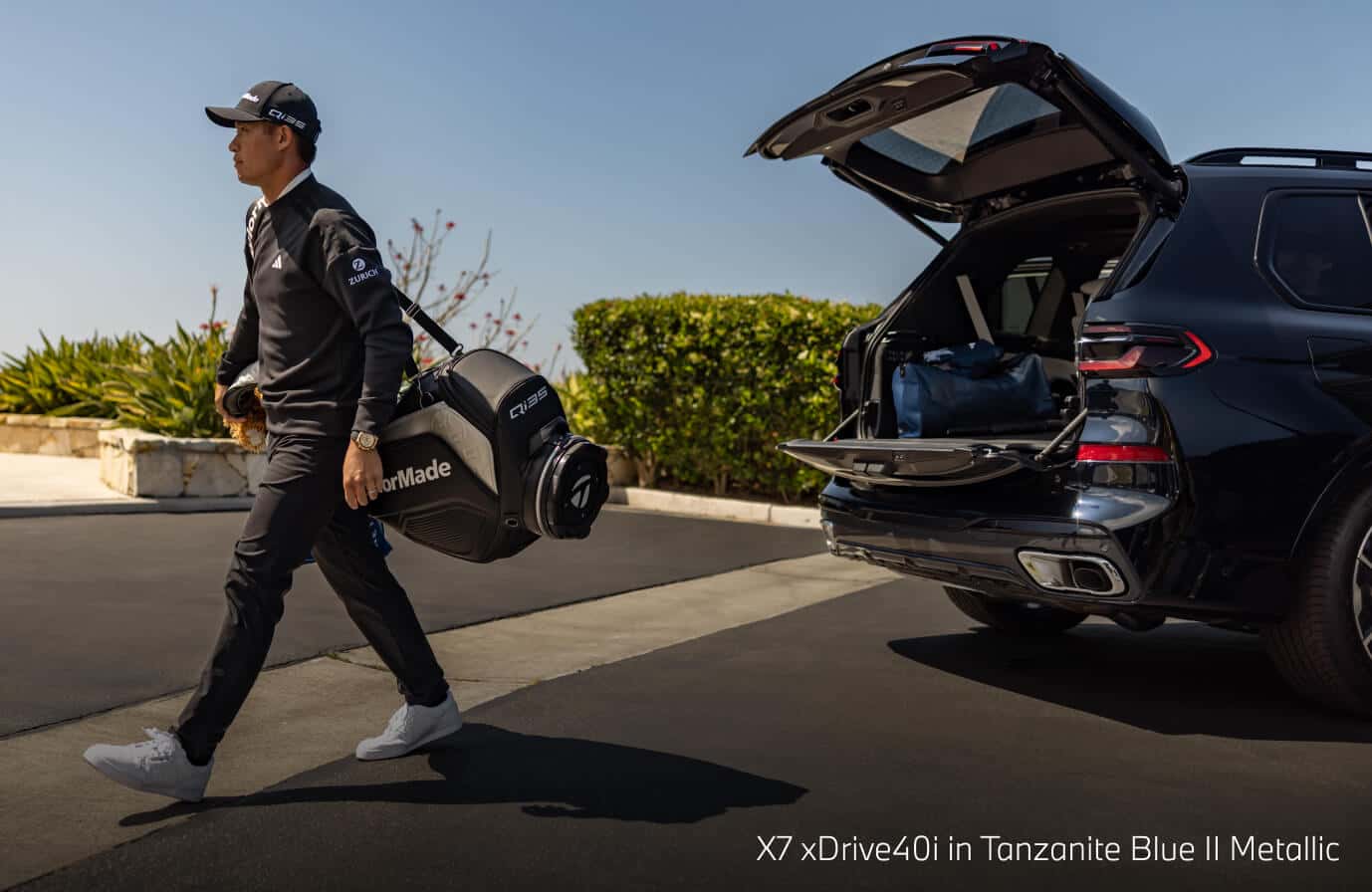 Man exiting the X7 xDrive40i in Tanzanite Blue II Metallic