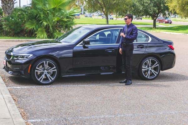 Man getting into a 2020 BMW 330i
