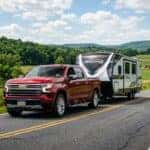 A powerful 2026 Chevrolet Silverado 1500 pulling a trailer in Pennsylvania in the summer