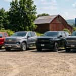 2026 chevy colorado parked next to silverado 1500 next to tahoe next to suburban on a gravel lot in pennsylvania in the summer