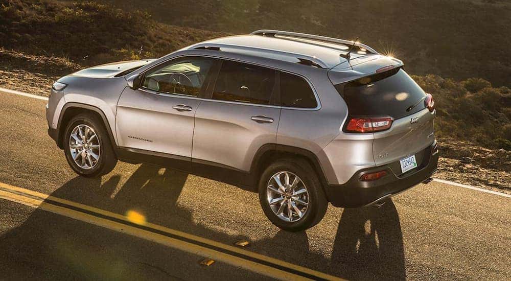 A silver 2018 Jeep Cherokee is shown from above at sunset.