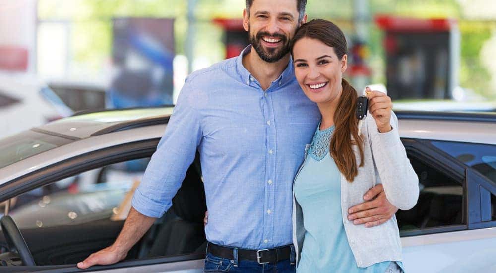 Joyful And Stunning Couple Poses By Their Car Photo Background And Picture  For Free Download - Pngtree