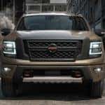 A tan 2021 Nissan Titan XD is shown from the front after leaving a diesel trucks in Durham, NC.