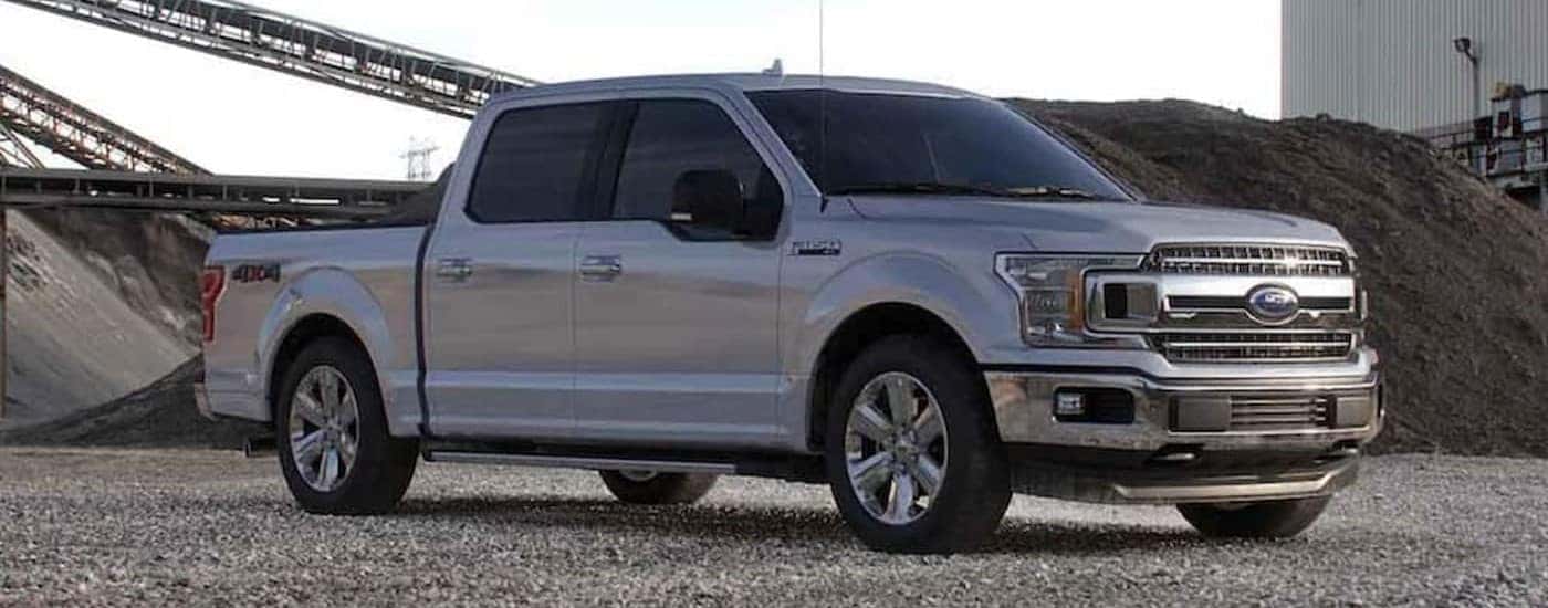 A silver 2020 Ford F-150 parked at an industrial construction site