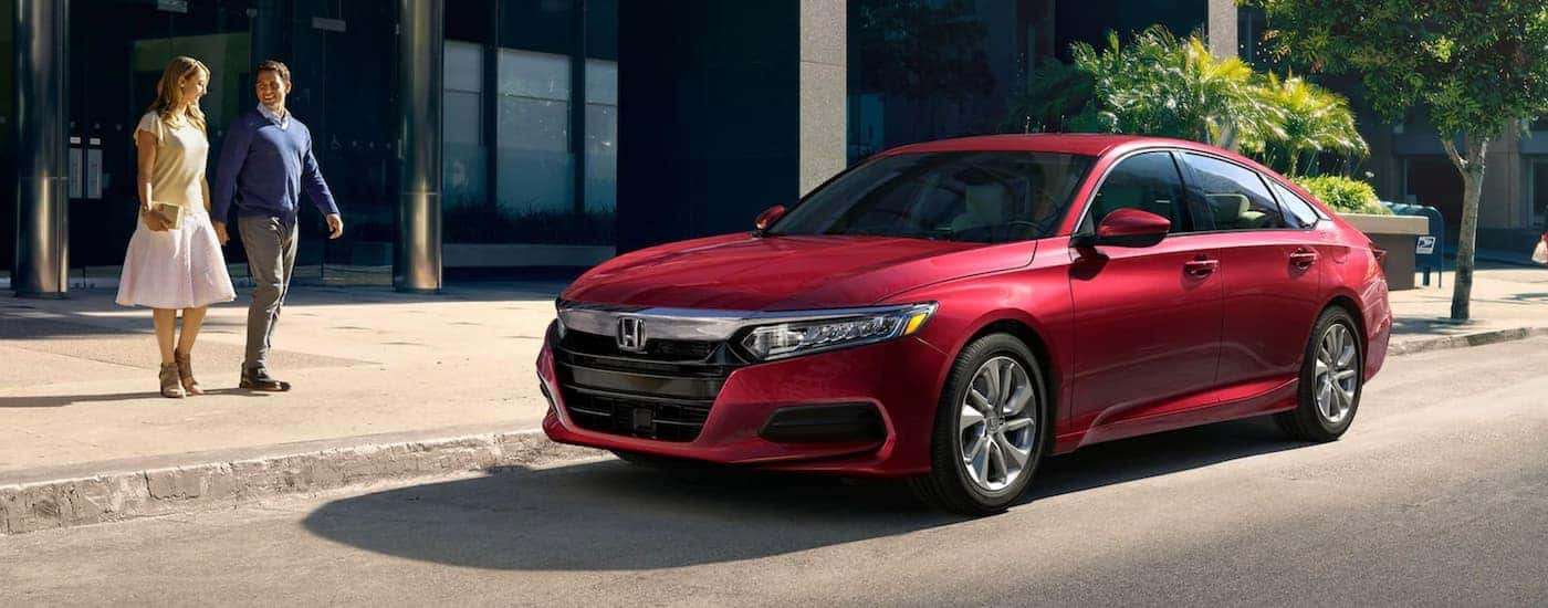 A red 2020 Honda Accord LX is shown parked on a city street.