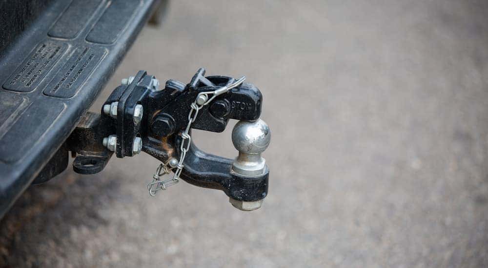 Close-up of a trailer hitch available on used trucks.