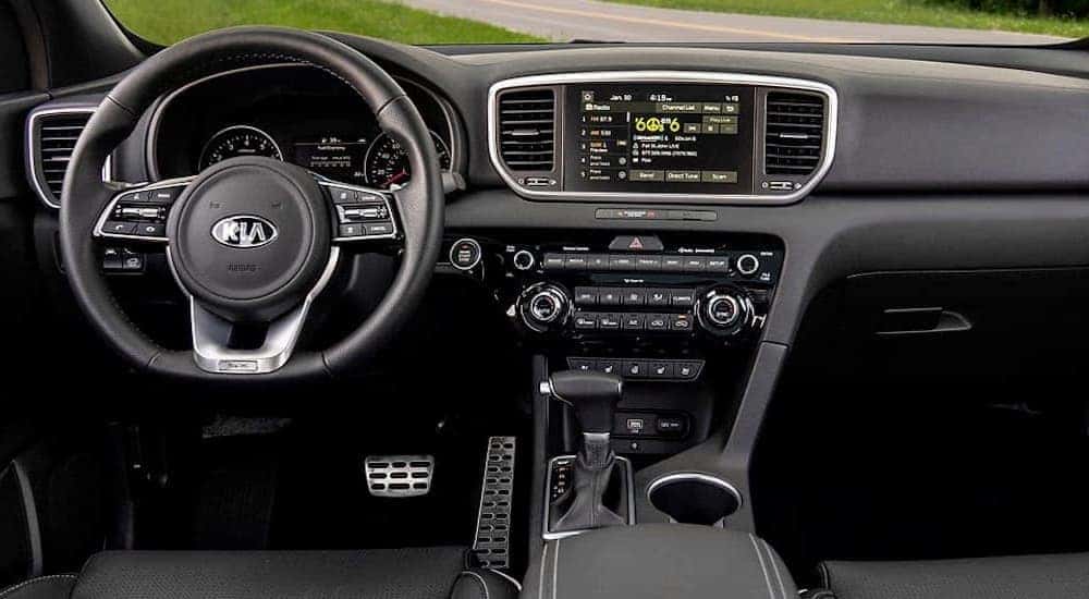 The interior and dashboard of a 2020 Kia Sportage, one of many used SUVs for sale.