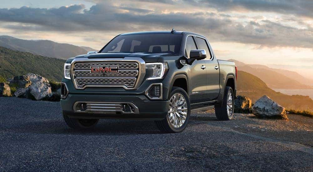 A gray 2019 GMC Sierra 1500 Denali is shown parked off-road.