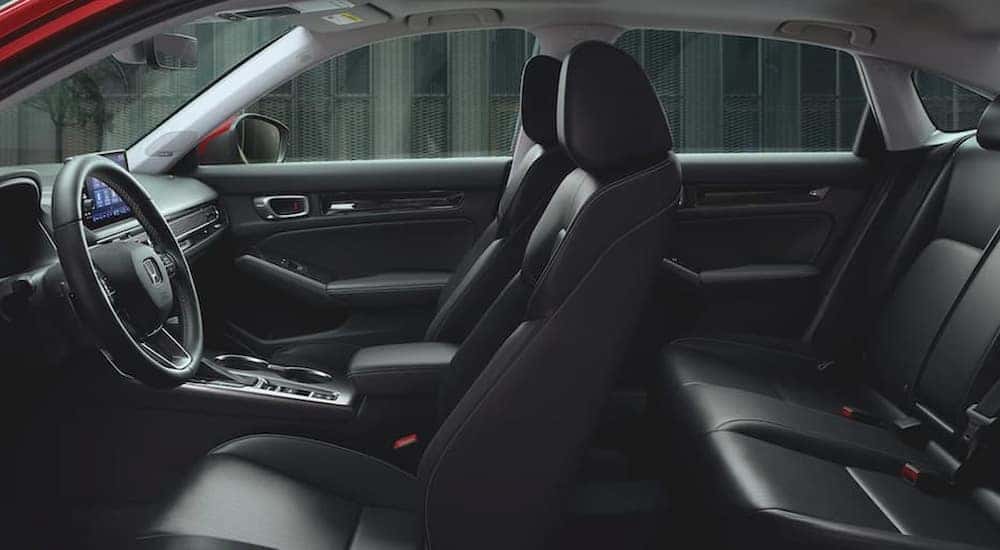 Cutaway view of the black leather seating in a 2022 Honda Civic Touring, a used car for sale near Raleigh.