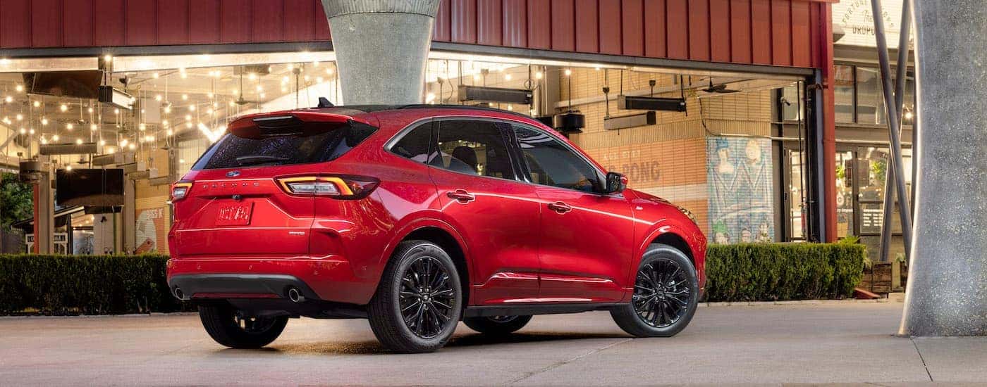 Red 2023 Ford Escape ST parked outside of a restaurant 