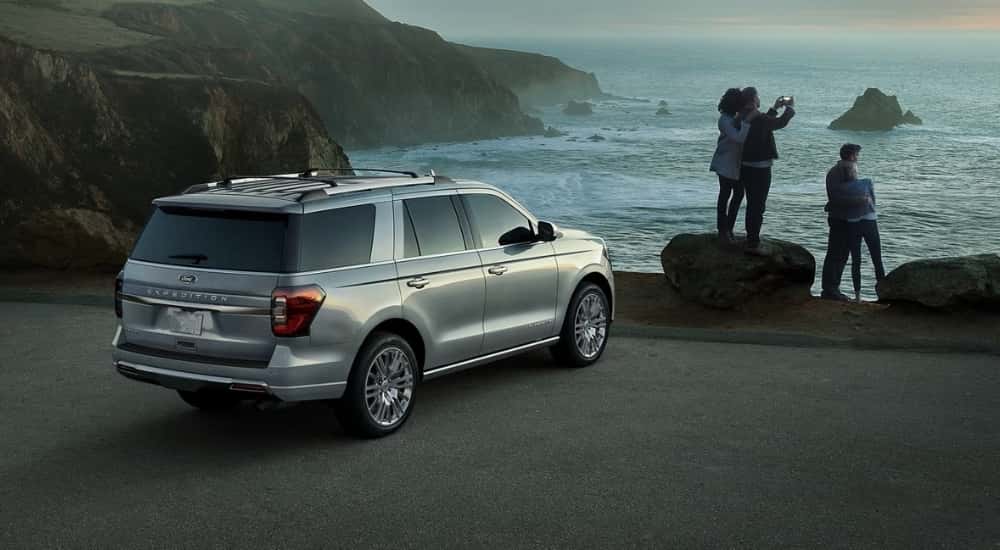 A silver 2024 Ford Expedition Limited parked on a costal lot.
