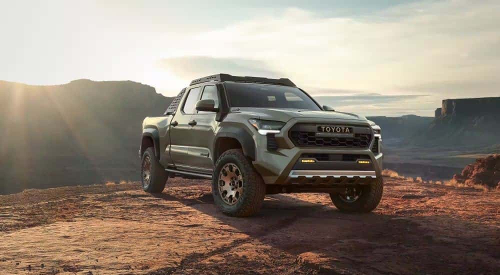 A green 2024 Toyota Tacoma Trailhunter from a car dealership in Roxboro