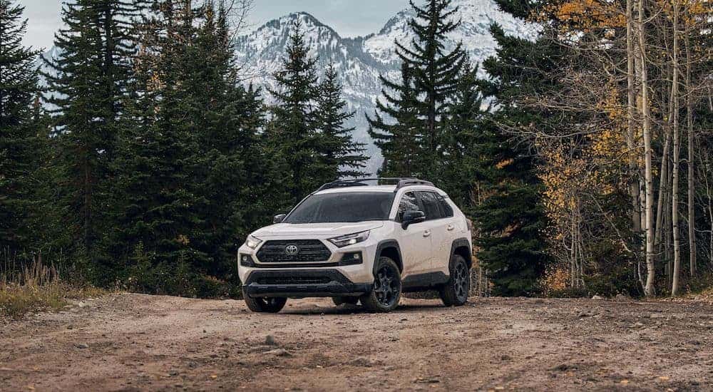 A white 2022 Toyota RAV4 from the front at an angle after leaving a car dealership in Roxboro..