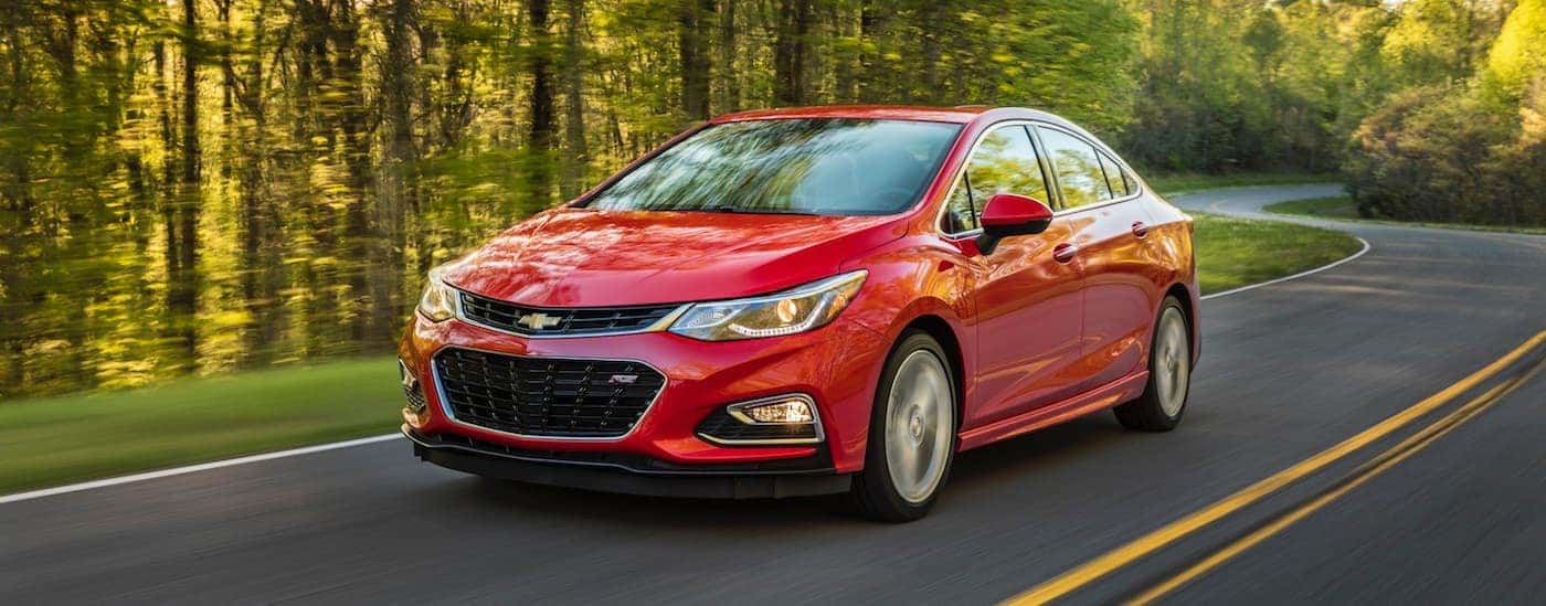 A red 2018 Chevy Cruze from the front at an angle.