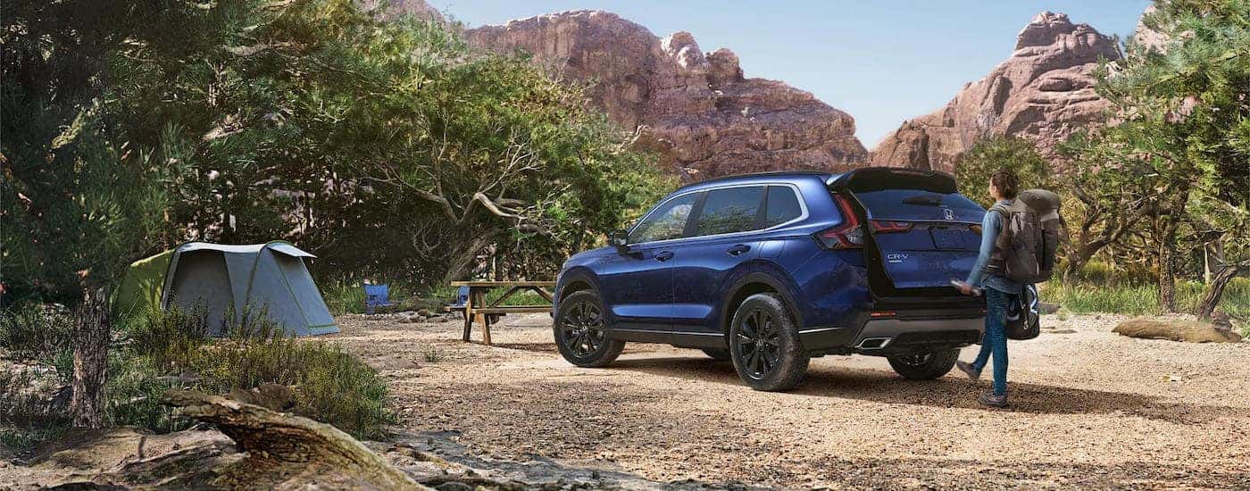 A blue 2023 Honda CR-V from the rear at an angle.