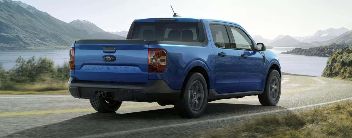 A blue 2024 Ford Maverick from the rear at an angle.