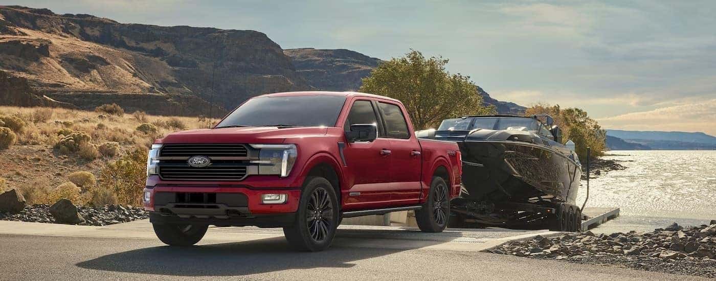 A red 2025 Ford F-150 from the front at an angle.
