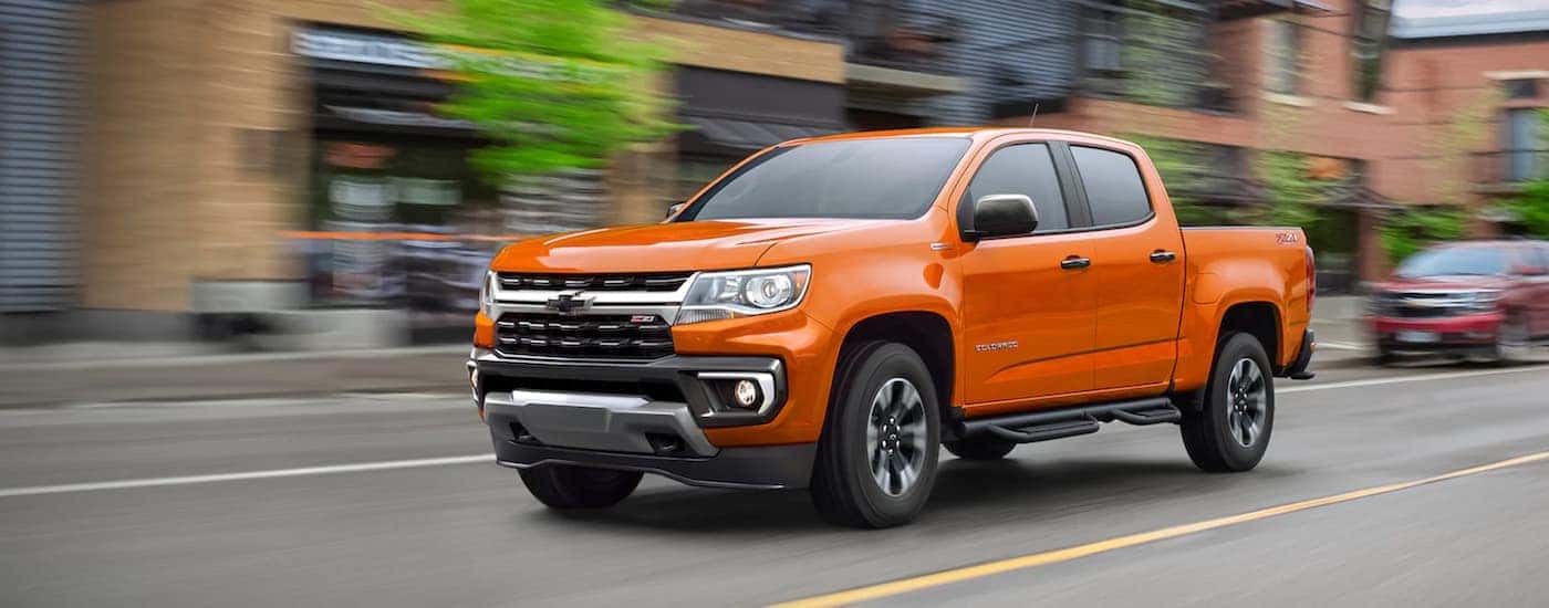 An orange 2021 Chevy Colorado from the front at an angle.
