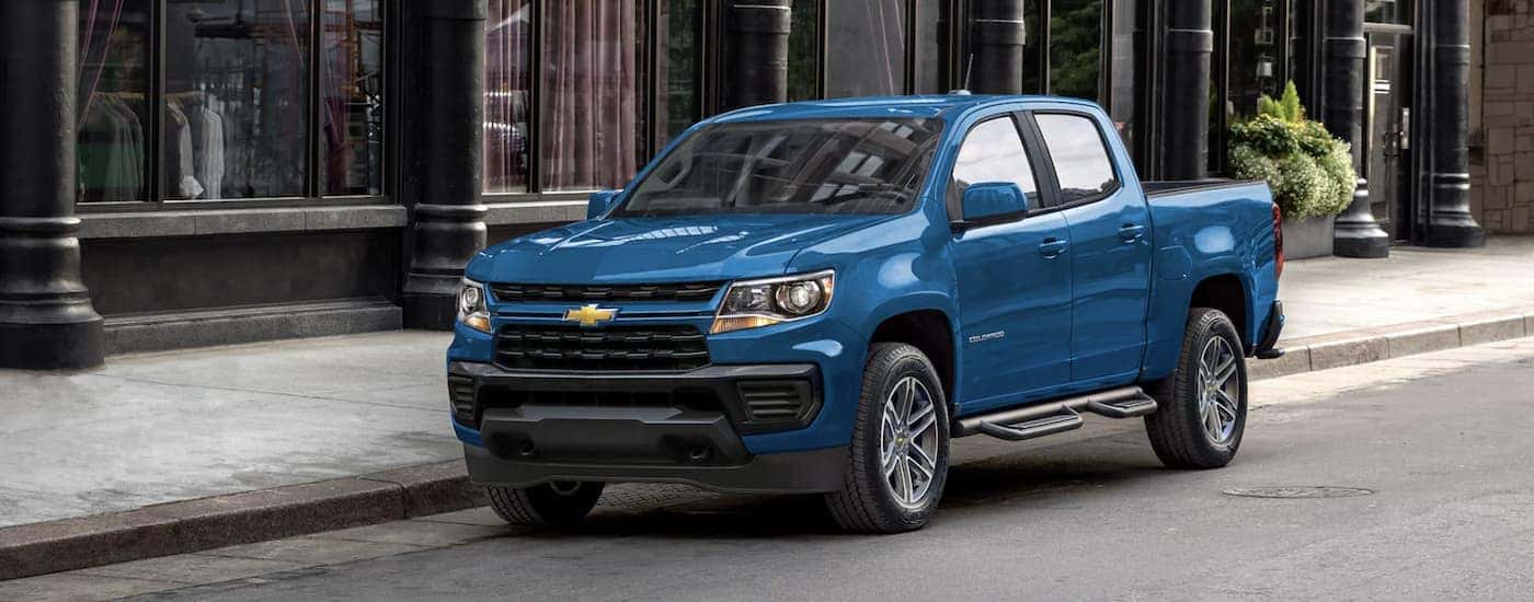 A blue 2022 Chevy Colorado WT parked on a city street