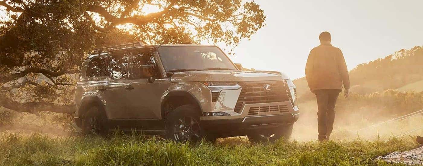 Silver 2024 Lexus GX parked off-road