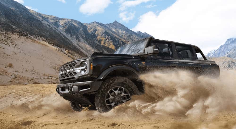 Black 2025 Ford Bronco drifting off-road