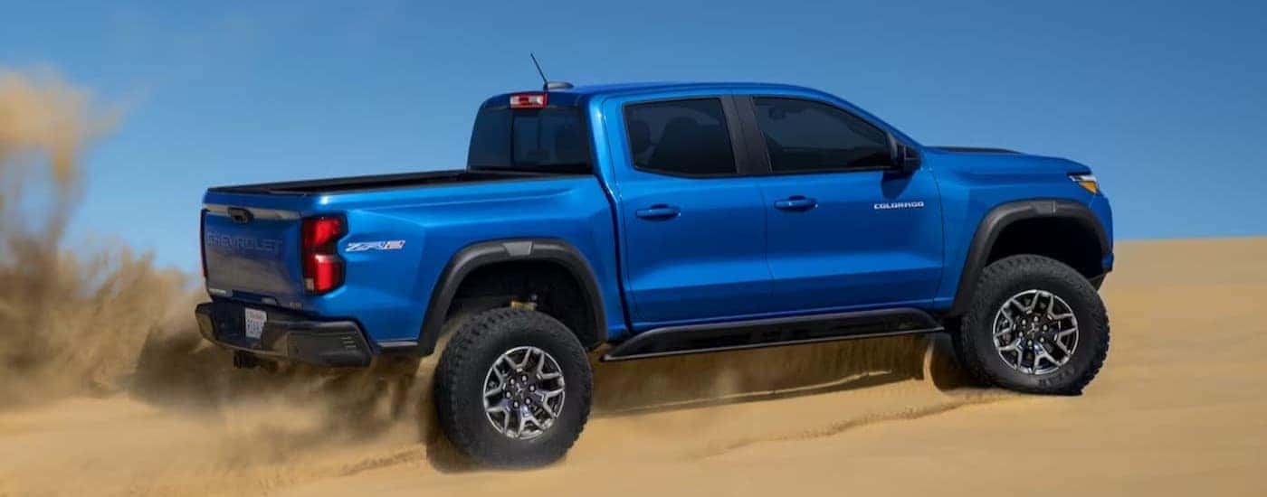 A blue 2024 Chevy Colorado ZR2 off-roading.