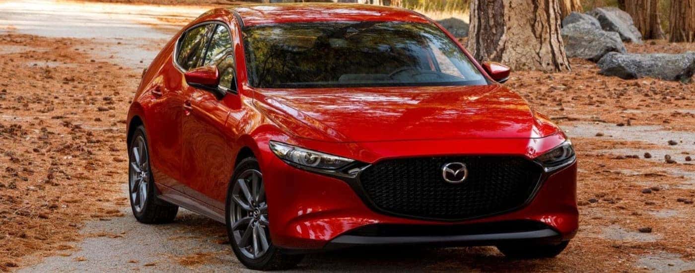A red 2020 Mazda3 is shown parked after viewing used cars for sale near Raleigh.