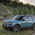 A blue 2025 Ford Bronco Sport from the side after leaving a dealer that has a used Ford for sale.