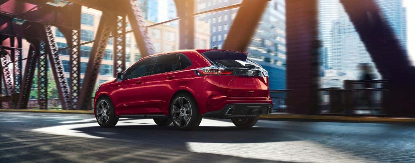 A red 2019 Ford Edge from the rear.