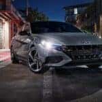 A gray 2023 Hyundai Elantra parked in a city.