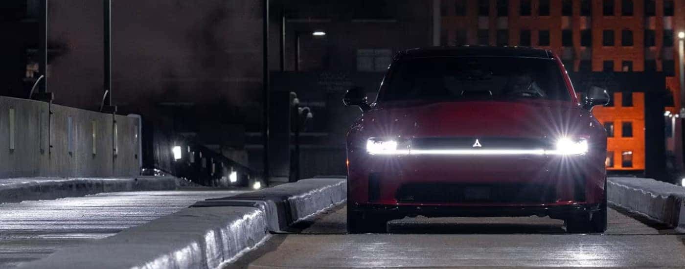 Red 2025 Dodge Charger driving at night