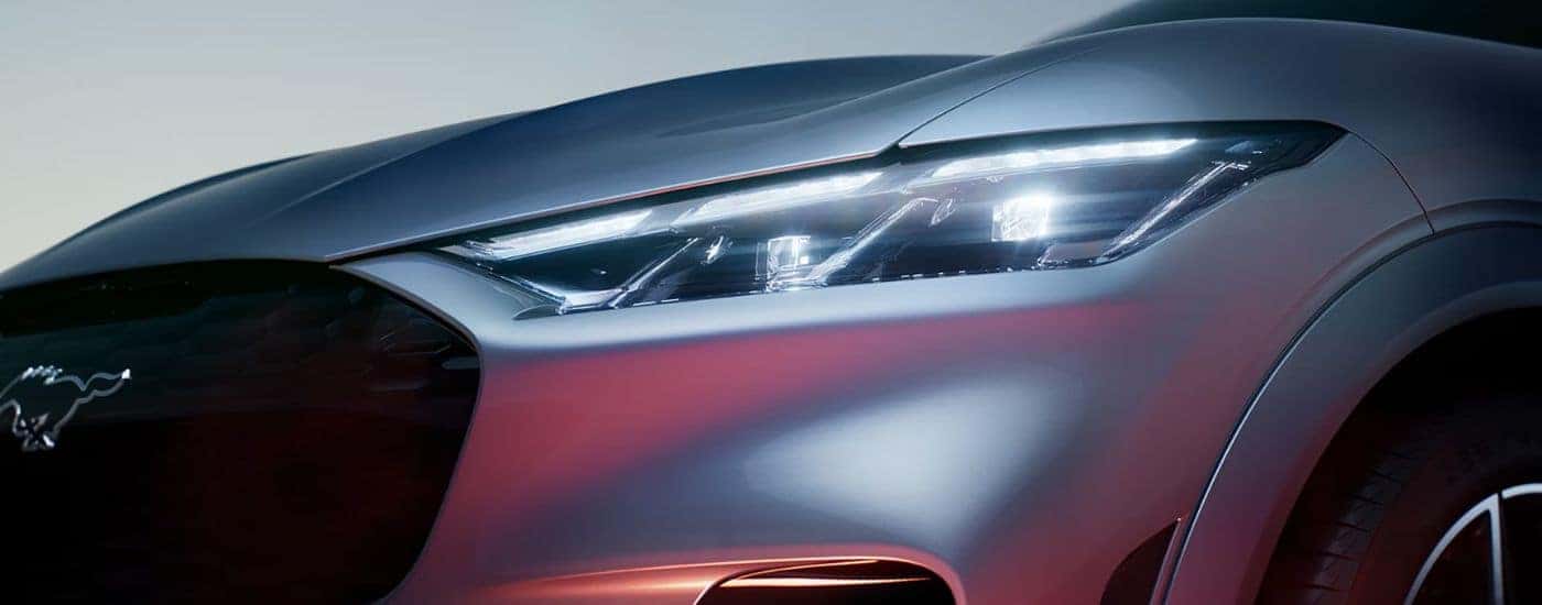 Close up on the headlight of a silver 2026 Ford Mustang Mach-E.