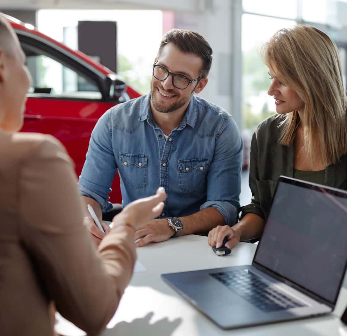 A male and female getting assistance at a Hyundai Dealership