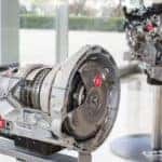 A close up shows the 3.5L V6 EcoBoost engine and 10 speed transmission from a 2016 Ford F-150.