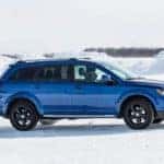 A blue 2020 Dodge Journey is shown from the side and parked in the snow after leaving a Dodge Journey dealer.