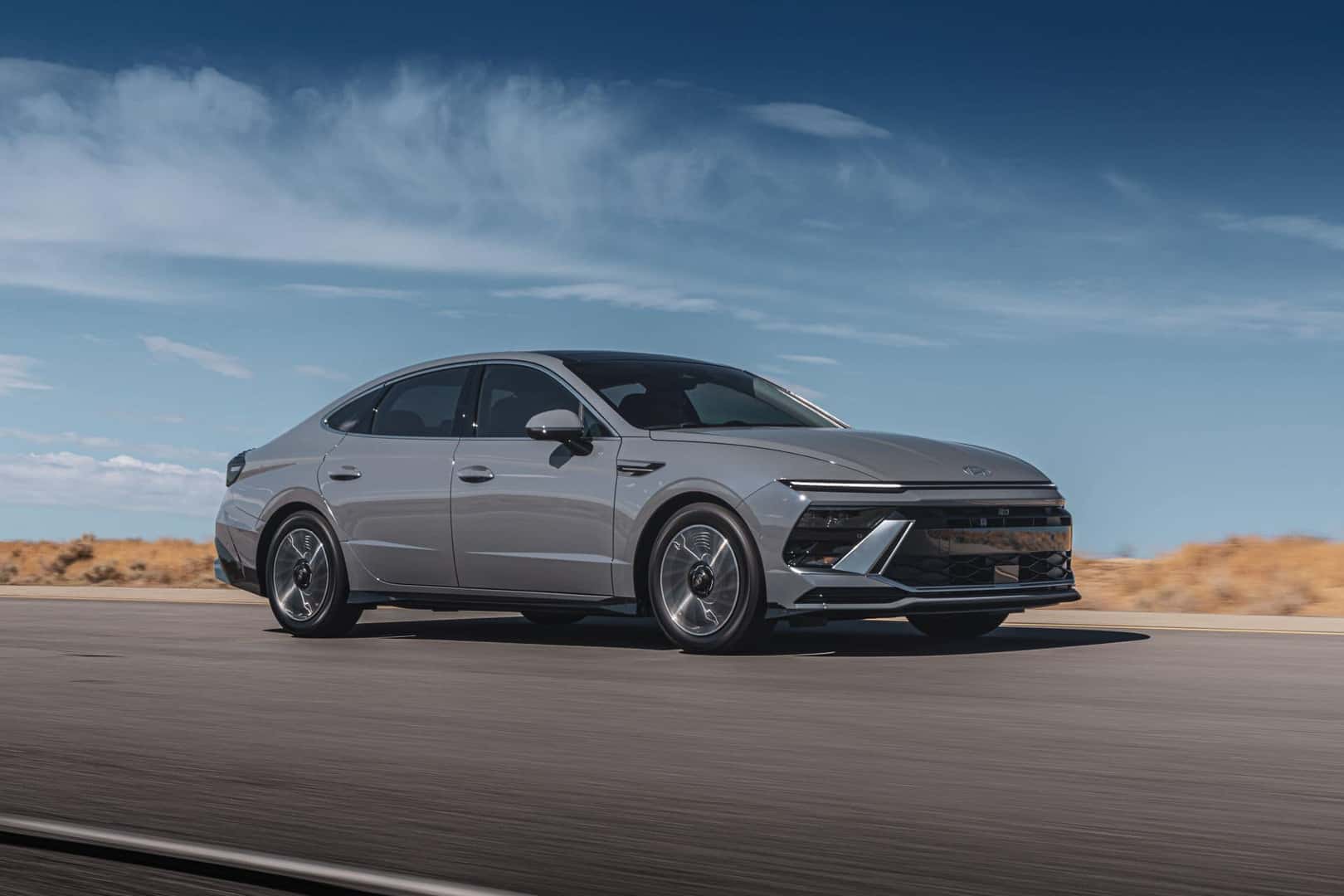 Gray Sonata Hybrid Limited driving on a road